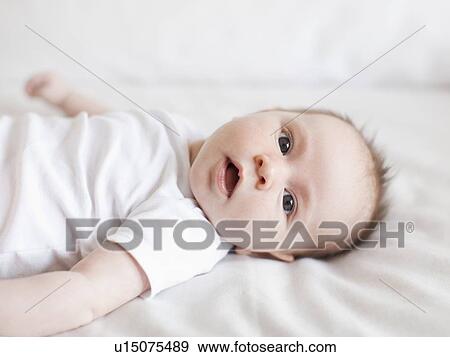 Portrait of baby boy (2-5 months) View Large Photo Image Stock Photo - Portrait of baby boy (2-5 months) . Fotosearch