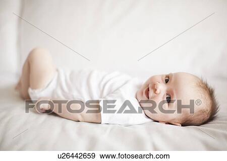 Stock Photo - Portrait of baby boy (2-5 months) . Fotosearch
