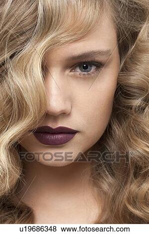 Portrait of beautiful girl with blonde curls View Large Photo Image Stock Photo - Portrait of beautiful girl with blonde curls. Fotosearch