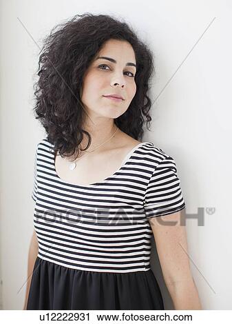 Stock Image - Portrait of beautiful young woman. Fotosearch