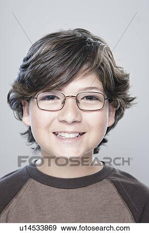 Portrait of boy (10-11), studio shot View Large Photo Image Stock Photo - Portrait of boy (10-11), studio shot. Fotosearch