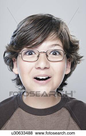 Portrait of boy (10-11), studio shot View Large Photo Image Stock Photo - Portrait of boy (10-11), studio shot. Fotosearch