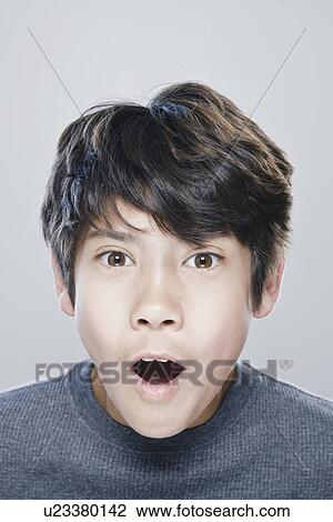 Portrait of boy (12-13) expressing surprise View Large Photo Image Stock Image - Portrait of boy (12-13) expressing surprise. Fotosearch