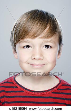 Picture - Portrait of boy (6-7), studio shot. Fotosearch