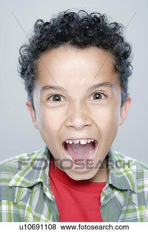 Portrait of boy (8-9), studio shot View Large Photo Image Stock Photo - Portrait of boy (8-9), studio shot. Fotosearch