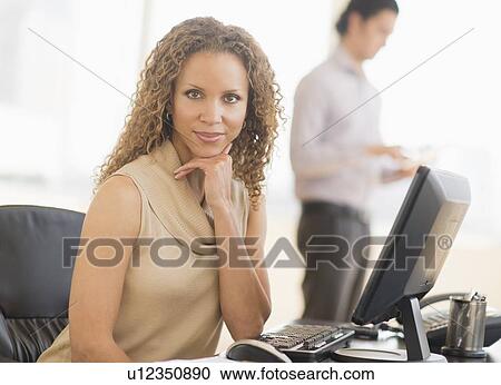 Portrait of business woman using computer View Large Photo Image Stock Image - Portrait of business woman using computer. Fotosearch