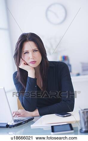 Portrait of businesswoman at desk View Large Photo Image Stock Image - Portrait of businesswoman at desk. Fotosearch
