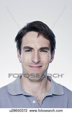 Portrait of confused man, studio shot View Large Photo Image Stock Image - Portrait of confused man, studio shot. Fotosearch