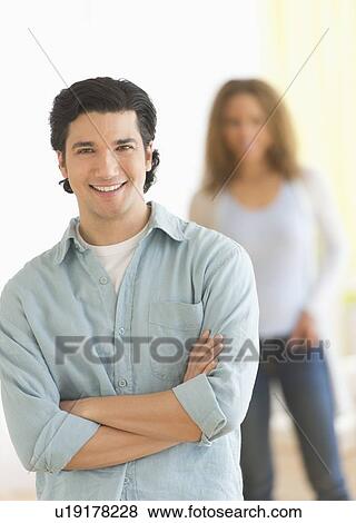 Portrait of couple with focus on man in foreground View Large Photo Image Stock Photo - Portrait of couple with focus on man in foreground. Fotosearch