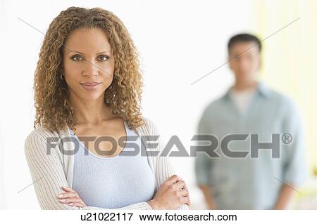 Portrait of couple with focus on woman in foreground View Large Photo Image Stock Photo - Portrait of couple with focus on woman in foreground. Fotosearch