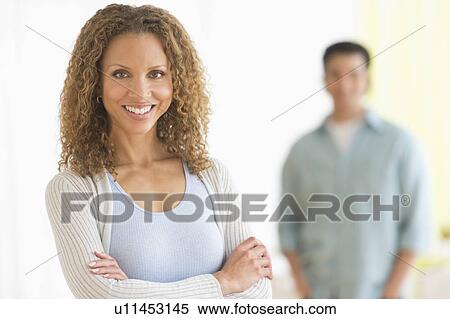 Portrait of couple with focus on woman in foreground View Large Photo Image Stock Photography - Portrait of couple with focus on woman in foreground. Fotosearch