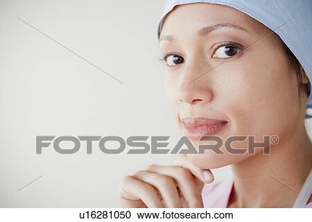 Stock Image - Portrait of doctor wearing surgical mask. Fotosearch