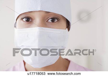 Portrait of doctor wearing surgical mask View Large Photo Image Stock Image - Portrait of doctor wearing surgical mask. Fotosearch