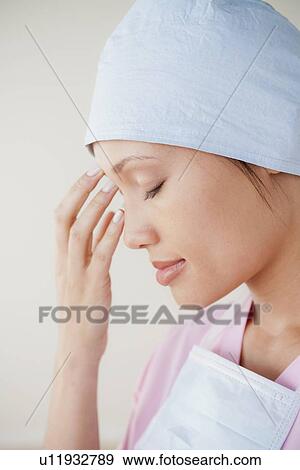 Portrait of doctor wearing surgical mask View Large Photo Image Stock Photo - Portrait of doctor wearing surgical mask. Fotosearch