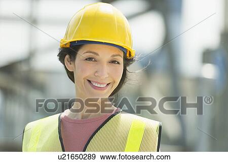 Stock Photo - Portrait of female construction worker. Fotosearch