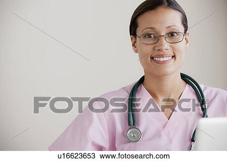 Portrait of female doctor View Large Photo Image Stock Image - Portrait of female doctor. Fotosearch