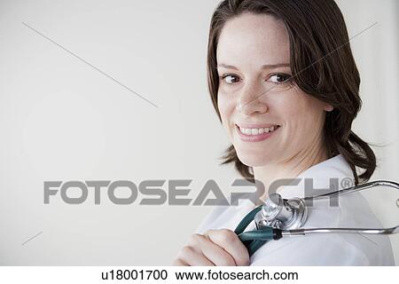 Stock Image - Portrait of female doctor. Fotosearch