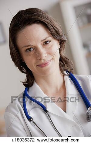 Stock Image - Portrait of female doctor. Fotosearch