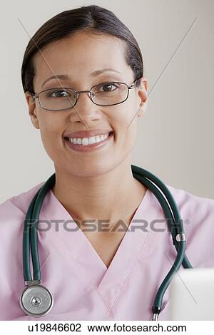 Portrait of female doctor View Large Photo Image Stock Image - Portrait of female doctor. Fotosearch