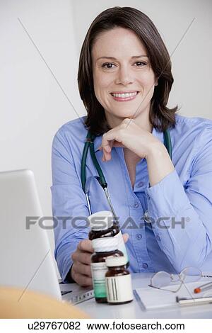 Portrait of female doctor View Large Photo Image Stock Image - Portrait of female doctor. Fotosearch