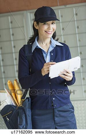Stock Photography - Portrait of female postal worker. Fotosearch