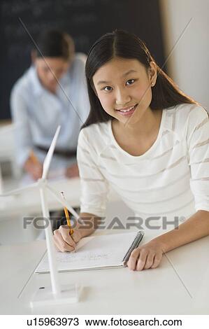 Stock Image - Portrait of female student (14-15) at school. Fotosearch