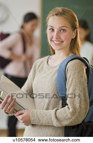 Picture - Portrait of female student (16-17) in classroom. Fotosearch