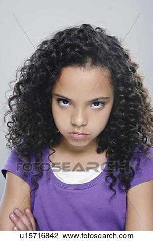 Portrait of girl (10-11), studio shot View Large Photo Image Stock Image - Portrait of girl (10-11), studio shot. Fotosearch