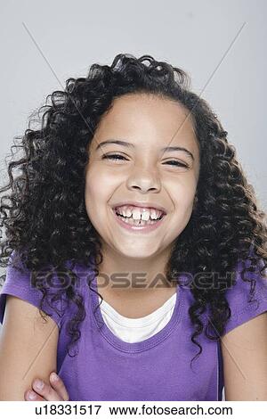 Portrait of girl (10-11), studio shot View Large Photo Image Stock Photo - Portrait of girl (10-11), studio shot. Fotosearch