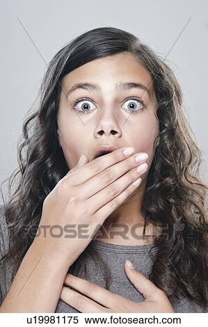 Portrait of girl (12-13) expressing fear View Large Photo Image Stock Photography - Portrait of girl (12-13) expressing fear. Fotosearch