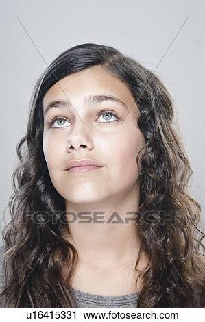 Portrait of girl (12-13) looking up View Large Photo Image Stock Image - Portrait of girl (12-13) looking up. Fotosearch