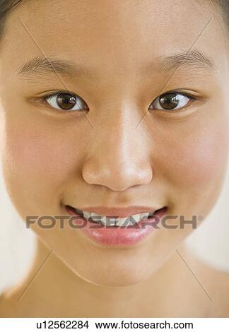 Portrait of girl (14-15) smiling View Large Photo Image Picture - Portrait of girl (14-15) smiling. Fotosearch