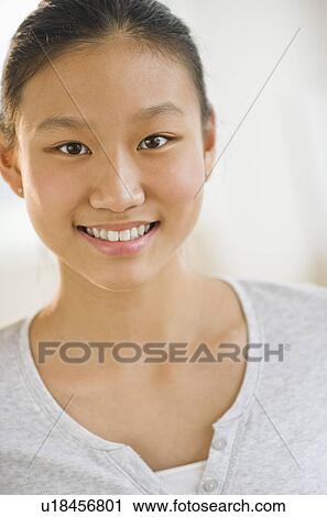 Stock Image - Portrait of girl (14-15) smiling. Fotosearch