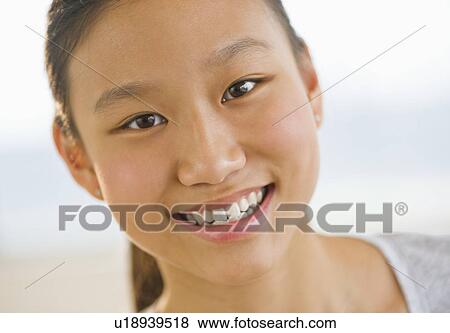 Portrait of girl (14-15) smiling View Large Photo Image Stock Photo - Portrait of girl (14-15) smiling. Fotosearch