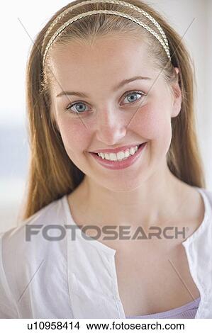 Portrait of girl (16-17) smiling View Large Photo Image Picture - Portrait of girl (16-17) smiling. Fotosearch