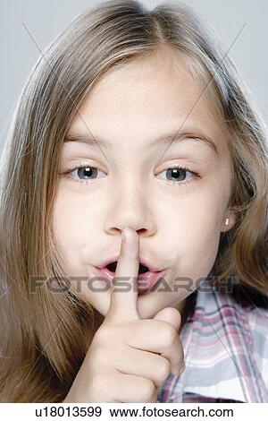Stock Photo - Portrait of girl (6-7), studio shot. Fotosearch