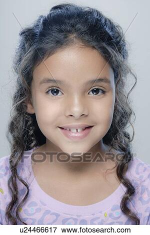 Portrait of girl (6-7), studio shot View Large Photo Image Stock Photo - Portrait of girl (6-7), studio shot. Fotosearch