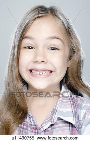 Stock Photography - Portrait of girl (6-7), studio shot. Fotosearch