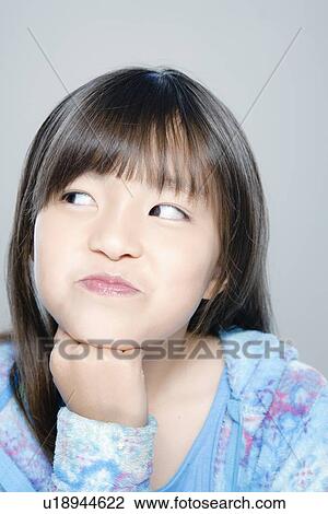 Portrait of girl (8-9), studio shot View Large Photo Image Stock Image - Portrait of girl (8-9), studio shot. Fotosearch