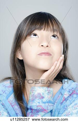 Portrait of girl (8-9), studio shot View Large Photo Image Stock Photo - Portrait of girl (8-9), studio shot. Fotosearch