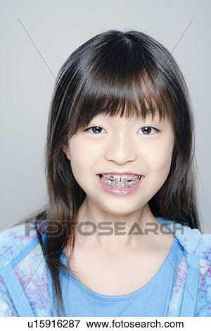Portrait of girl (8-9), studio shot View Large Photo Image Stock Photo - Portrait of girl (8-9), studio shot. Fotosearch