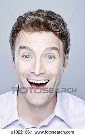 Portrait of happy mid adult man, studio shot View Large Photo Image Stock Photo - Portrait of happy mid adult man, studio shot. Fotosearch