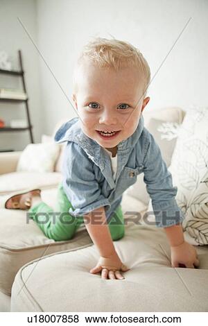 Stock Photo - Portrait of happy toddler boy (2-3). Fotosearch