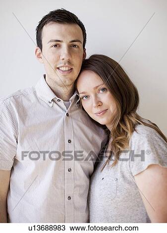 Stock Image - Portrait of happy young couple. Fotosearch