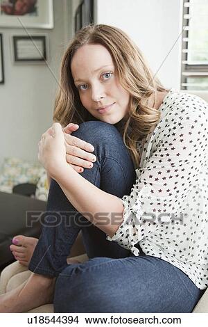 Picture - Portrait of happy young woman. Fotosearch