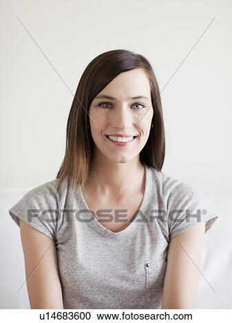 Stock Image - Portrait of happy young woman . Fotosearch