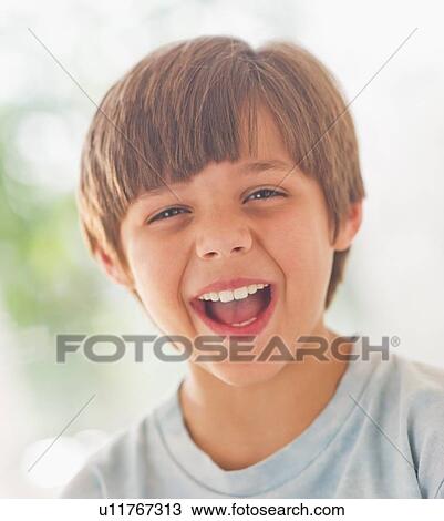 Portrait of laughing boy (10-11 years) View Large Photo Image Stock Image - Portrait of laughing boy (10-11 years) . Fotosearch