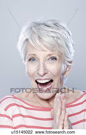 Portrait of laughing senior woman, studio shot View Large Photo Image Stock Image - Portrait of laughing senior woman, studio shot. Fotosearch