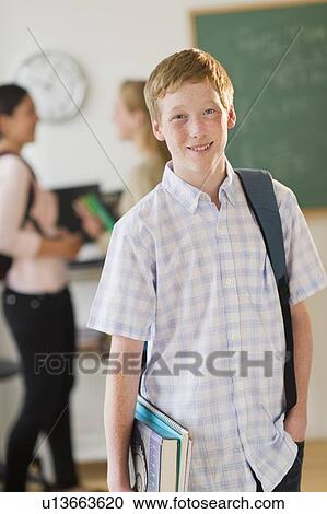 Portrait of male student (16-17) in classroom View Large Photo Image Stock Image - Portrait of male student (16-17) in classroom. Fotosearch