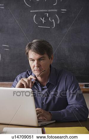 Stock Image - Portrait of maths teacher. Fotosearch